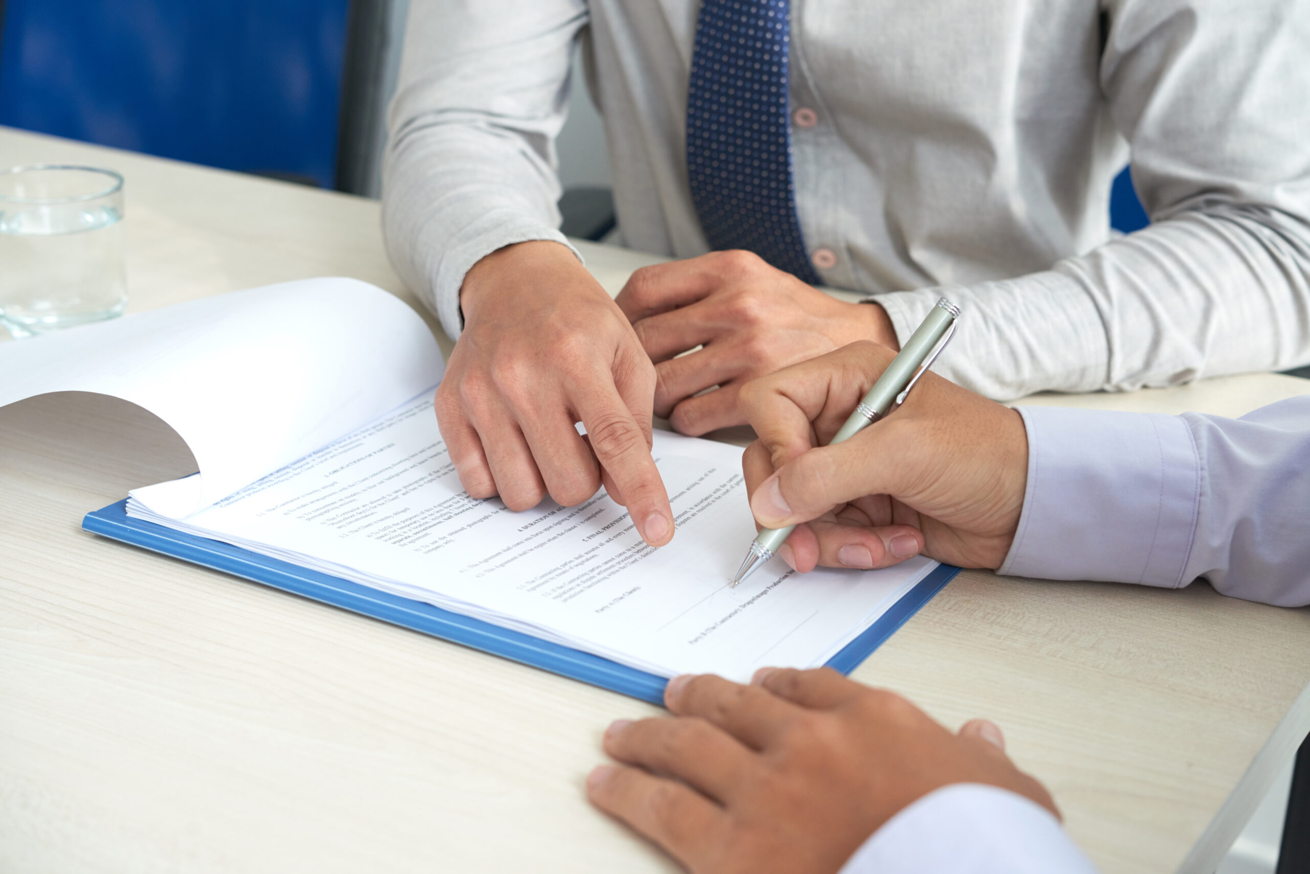 Businessman signing contract for new office