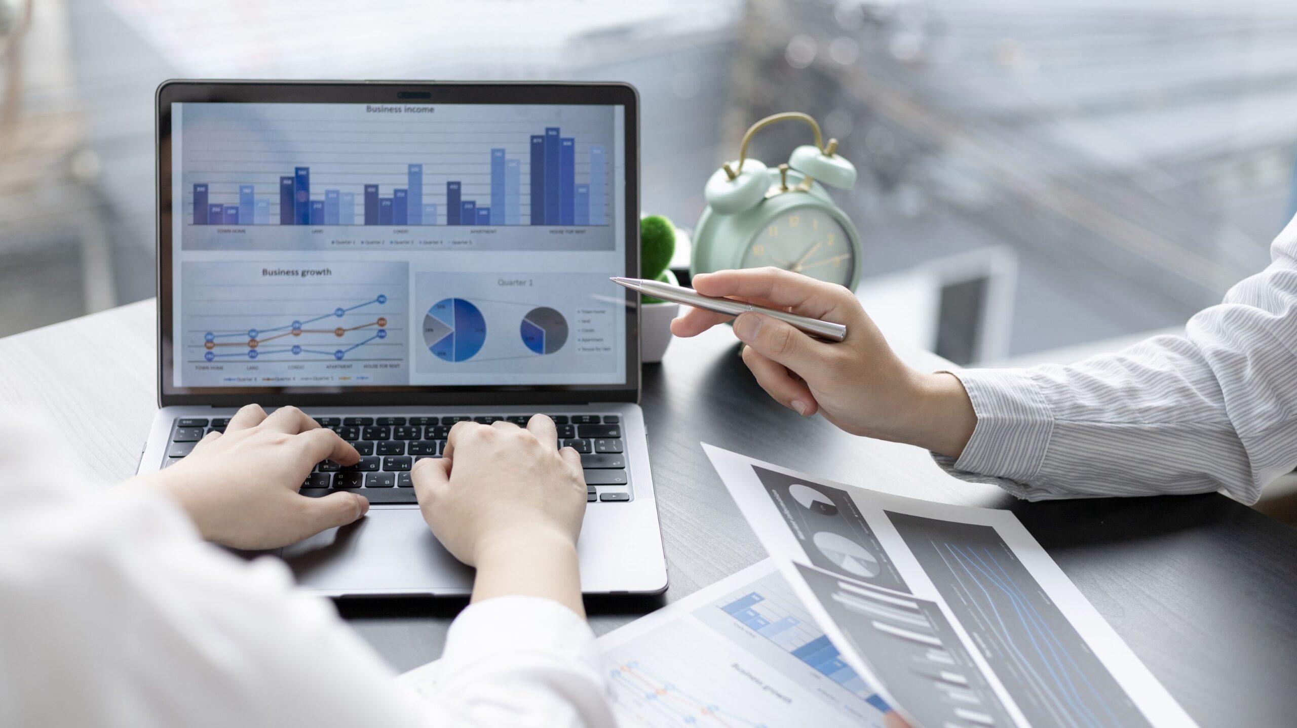 Business partners making a growth report together