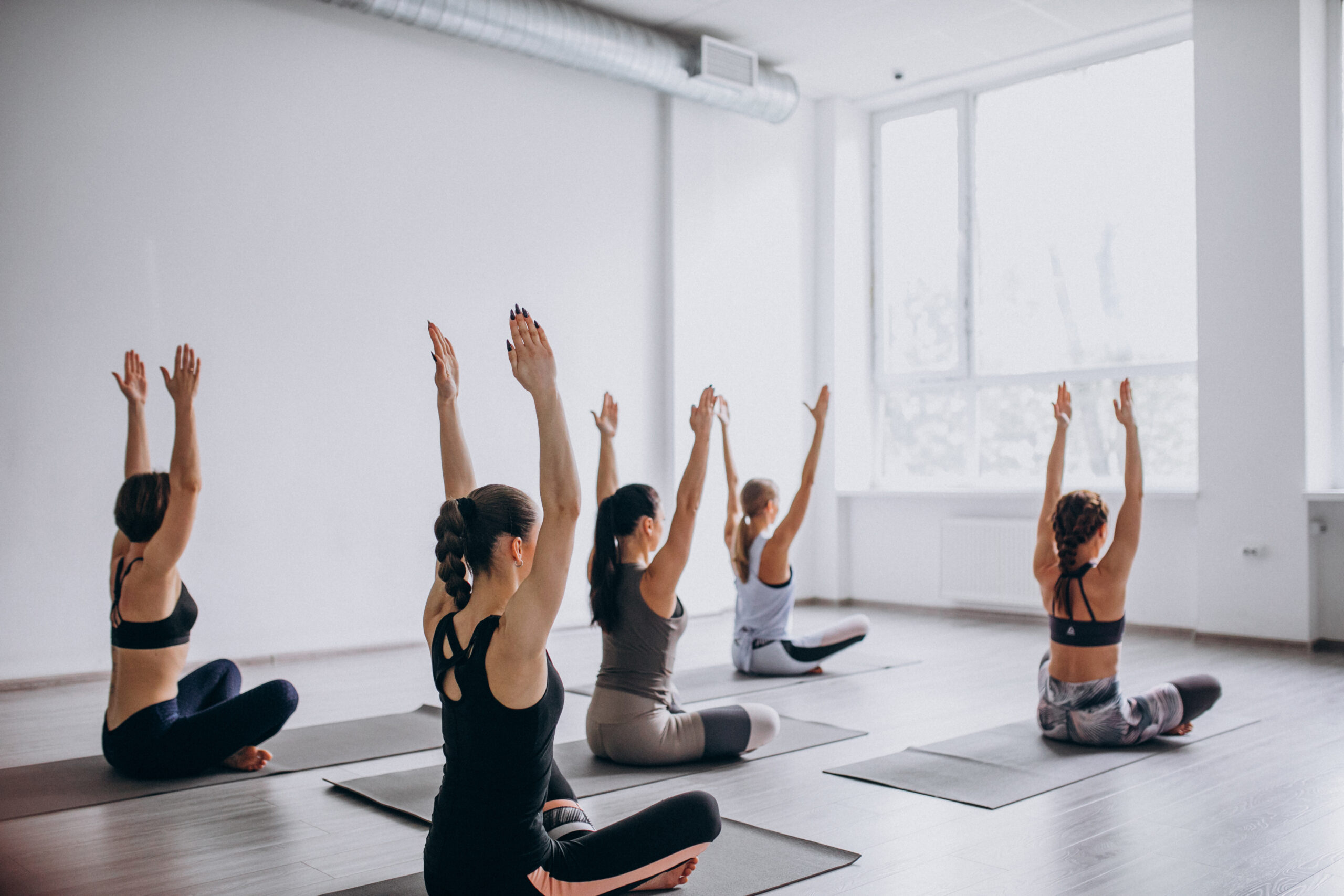 Colleagues performing yoga together