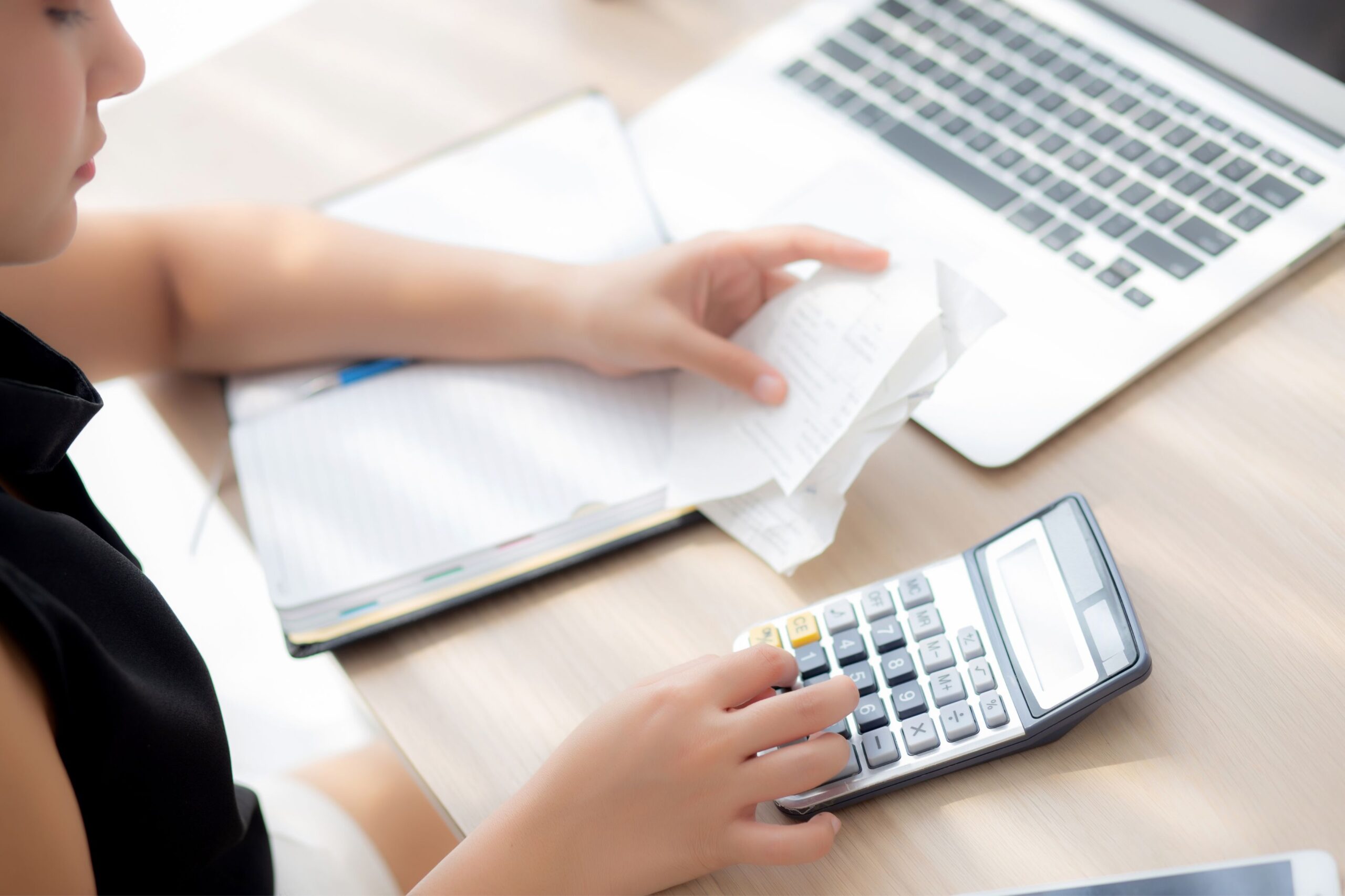 Woman calculating expenses