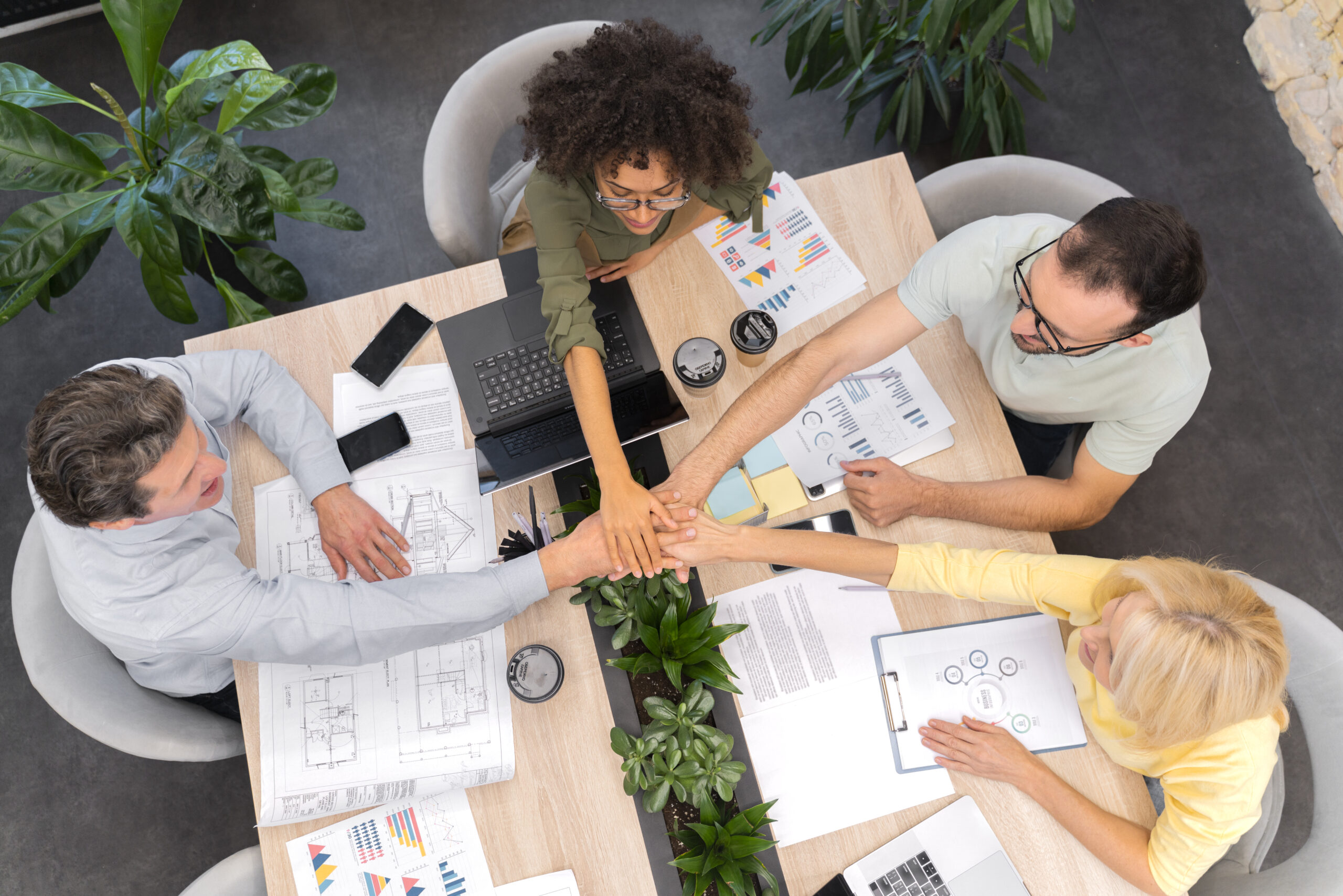 Close up of young business team collaborating together in the office