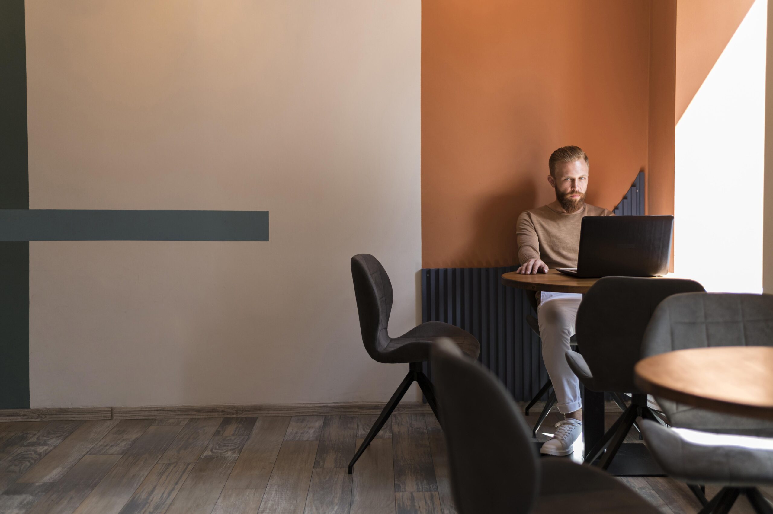 man working in quiet breakout space in office