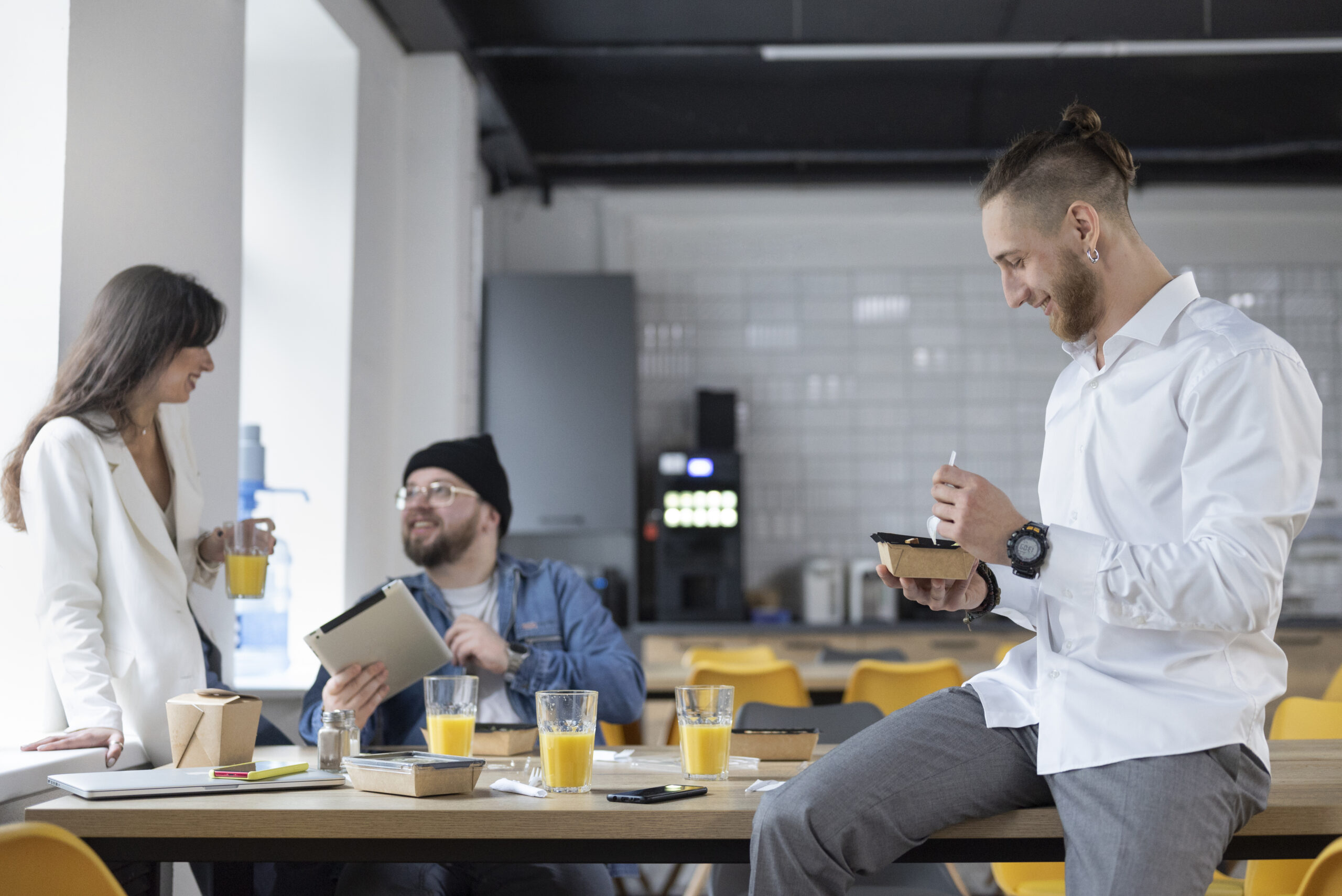 Employees enjoying their lunch break in the office breakout space