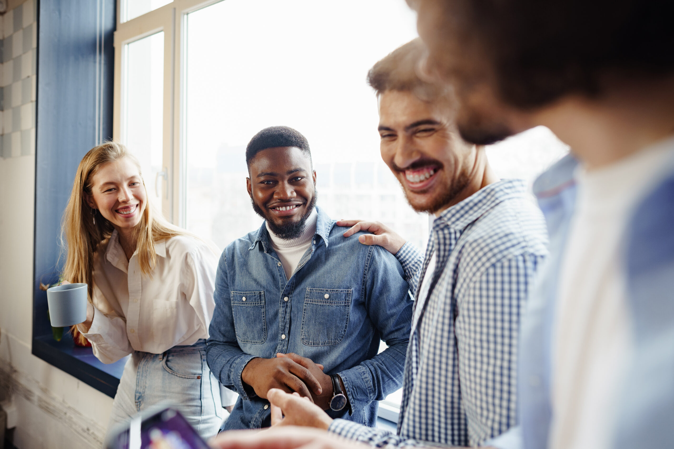 Happy employees gathered together