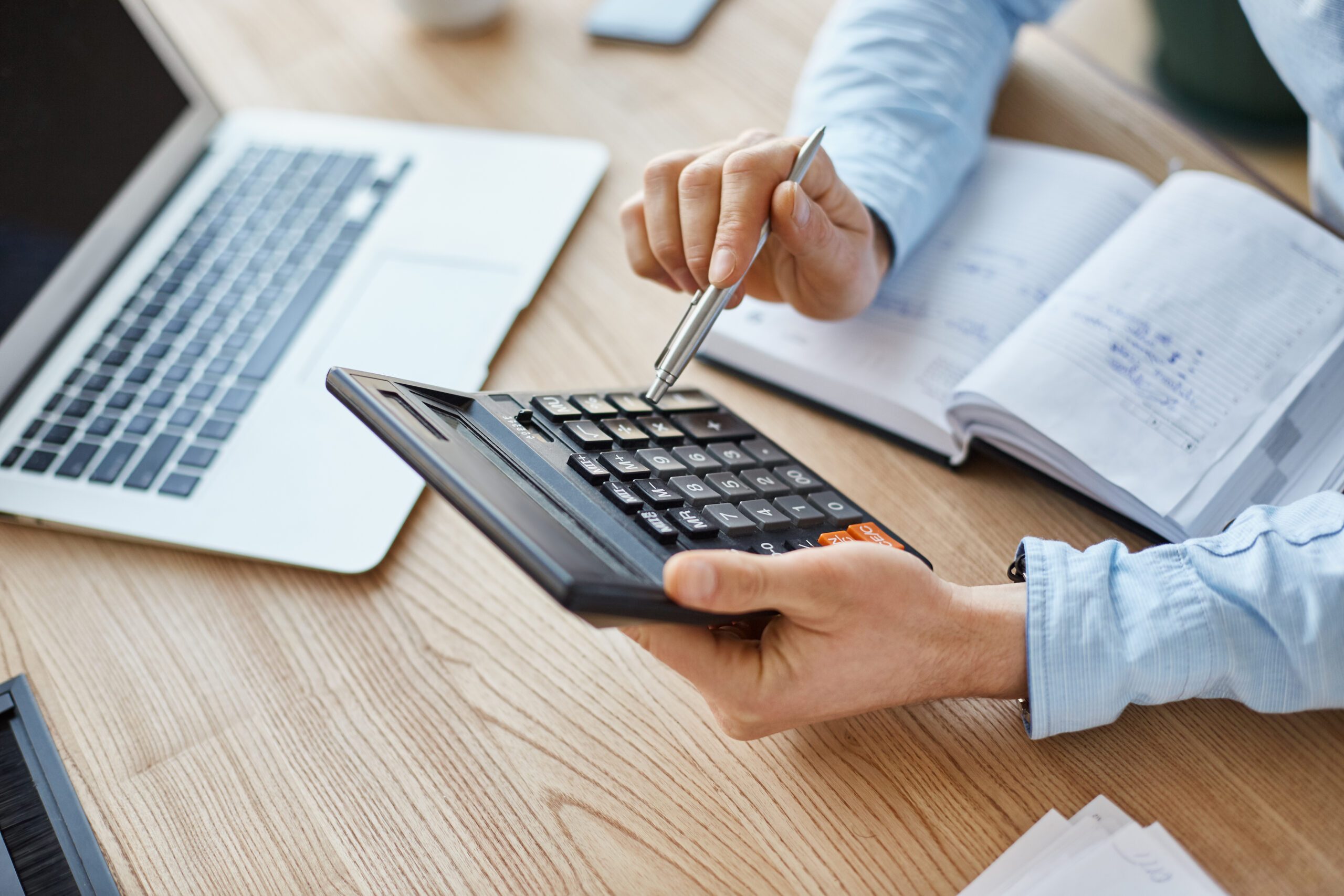 Office manager calculating costs for new office