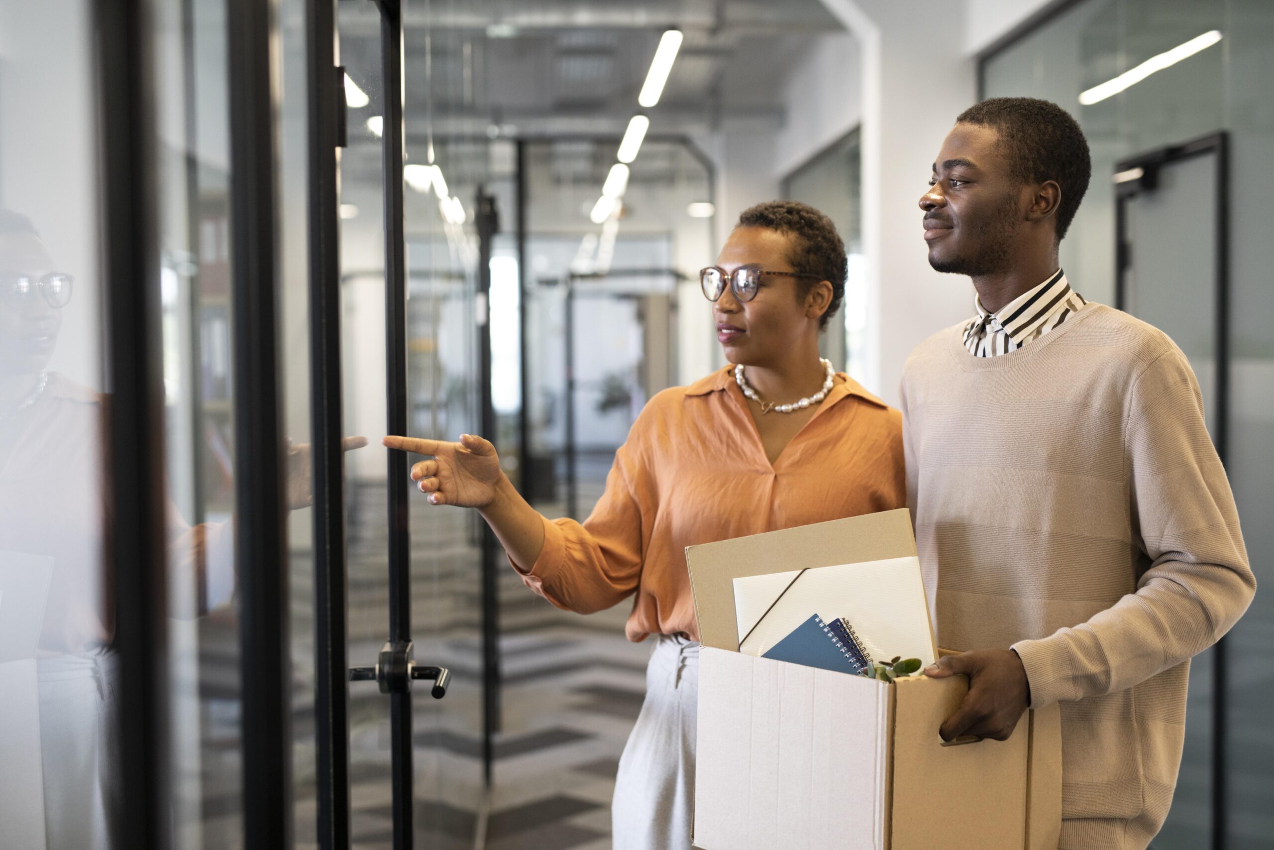 Two employees going through change management for new office design