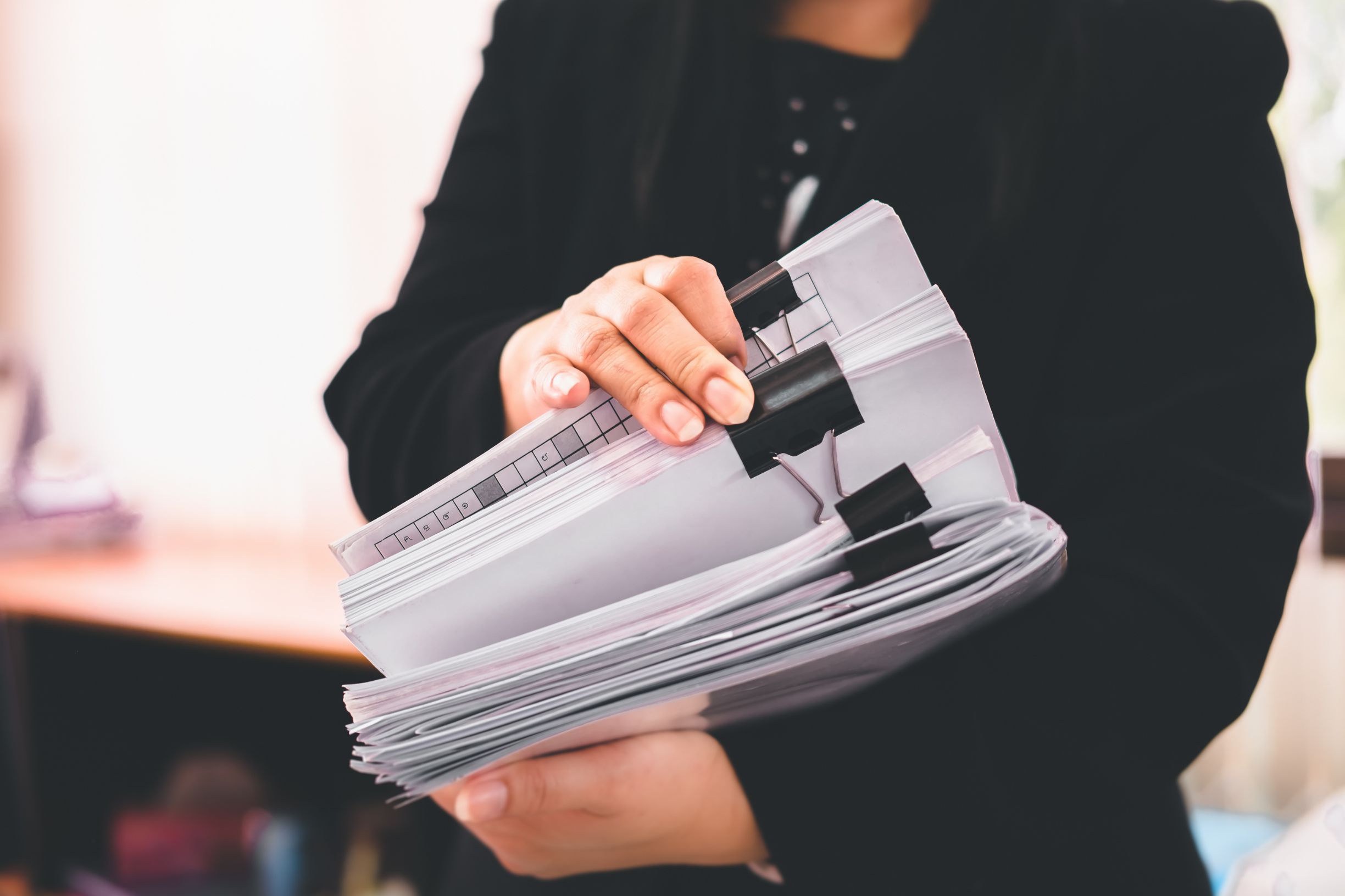Woman organising key documents